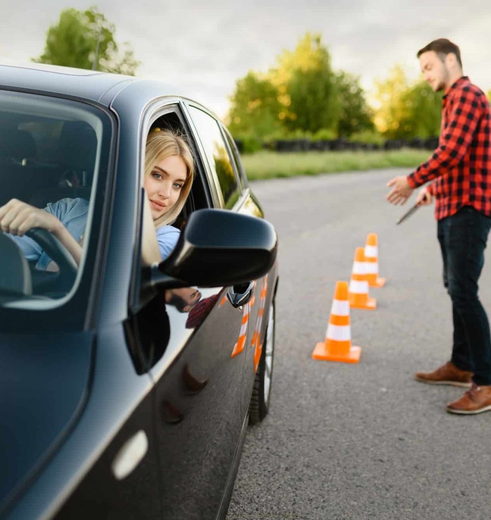 male-instructor-happy-with-driving-of-his-student.jpg